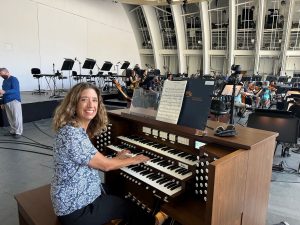 Organist Joanne Pearce Martin with the Allen Organ G330 during the Saint-Saens Organ Symphony practice session